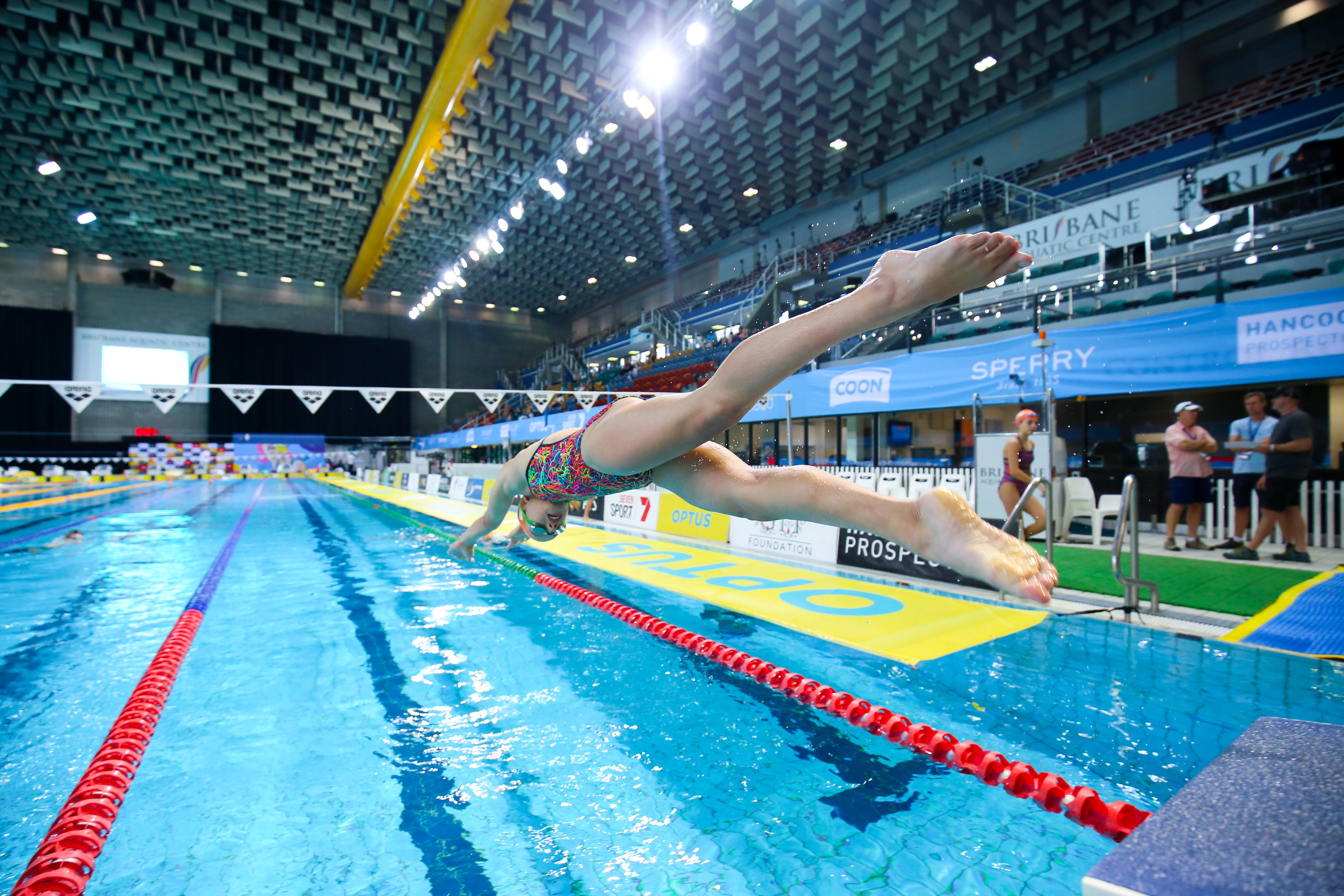 girl diving into pool